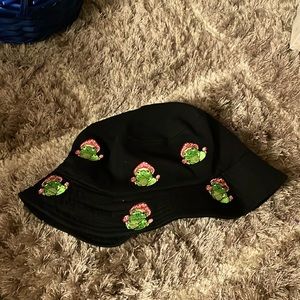 Bucket hat with frogs that are wearing mushroom hats